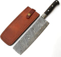 A Damascus steel kitchen knife with a patterned steel blade, a black handle with silver rivets, shown next to its brown leather sheath on a white background.