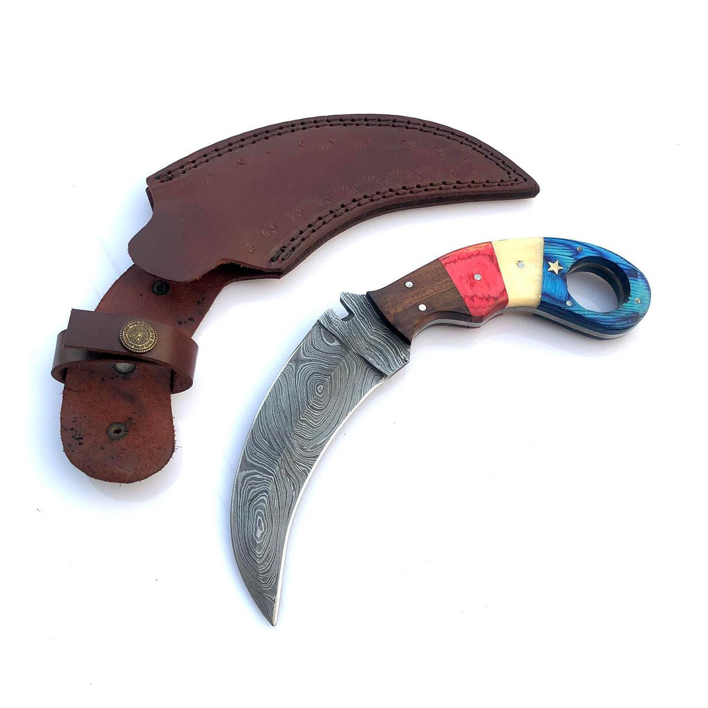 A curved Damascus steel knife with a colorful handle and a brown leather sheath, displayed on a clean white background.