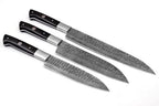 Three kitchen knives with patterned steel blades and black handles, arranged diagonally on a plain white background.