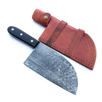A kitchen knife with a patterned Damascus steel blade and a black handle, shown next to its brown leather sheath on a white background.