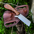 A fixed-blade knife with a rasp file steel blade and a brown wooden handle, displayed on a brown leather sheath outdoors on a tree branch with green foliage in the background. The text 'KNIVES' is overlaid on the image.