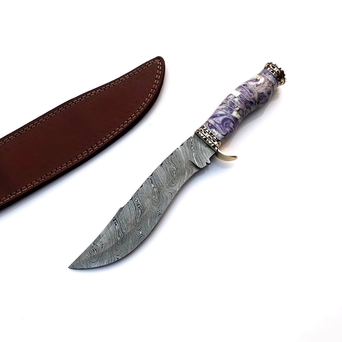 A custom fixed-blade knife with a patterned Damascus steel blade, a purple and white marbled handle, and a brass guard, shown next to its brown leather sheath on a white background.