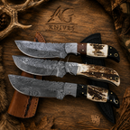 Three fixed-blade knives with patterned steel blades and mixed bone/bone-look handles are arranged on a rustic wood surface with a leather sheath and antler props. The engraved logo 'AG Knives' is visible above.