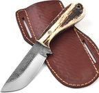 A fixed-blade knife with a textured silver blade and a natural antler-style handle, shown resting on a brown leather sheath against a white background.